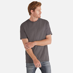 man wearing grey blank t shirt from delta apparel wholesale clothing style 65000 Magnum Weight Adult 6.0 Oz Short Sleeve Tee buy in bulk