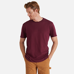 man wearing maroon blank t shirt from delta apparel wholesale style 12600L Soft Adult 4.3 Oz Softspun Tee buy in bulk 