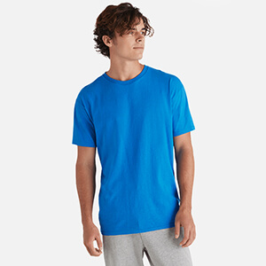 man looking to the left wearing delta apparel blank wholesale t shirt style 11730 in royal blue