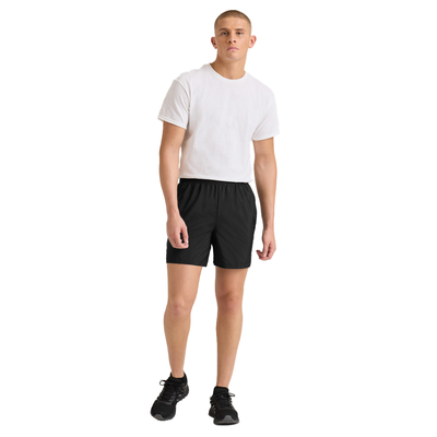 man facing front in a white shortsleeve tshirt with black shorts 031M