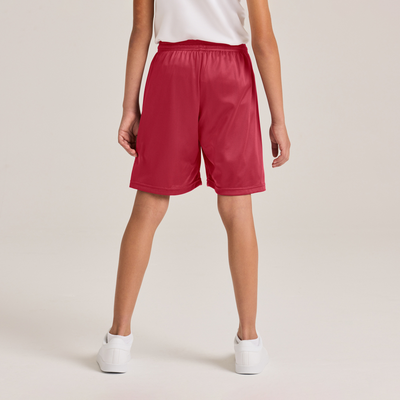boy facing back in a white tee with red shorts 060B