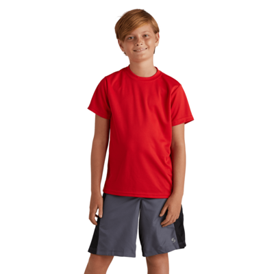 boy facing front wearing a red tshirt and grey and black training shorts