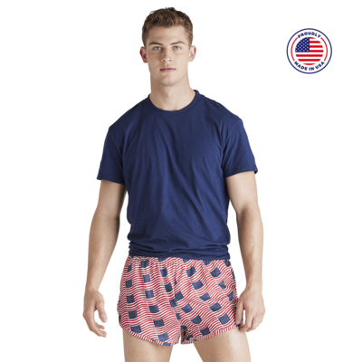 man facing front in a navy short sleeve t shirt in american flag printed running shorts