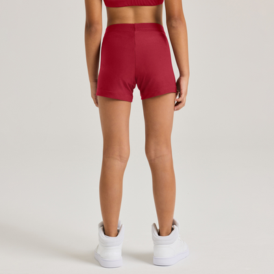 girl facing backwards wearing red compression shorts close up on shorts