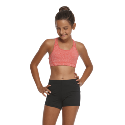girl facing front with hand on hips wearing a red sports bra and black compression shorts