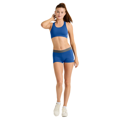 woman facing forward wearing blue sports bra and compression short 1110V