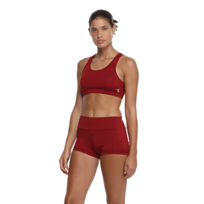 woman facing front with red sports bra and red compression shorts