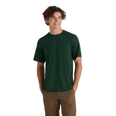 man wearing green tee from delta apparel wholesale style 116535