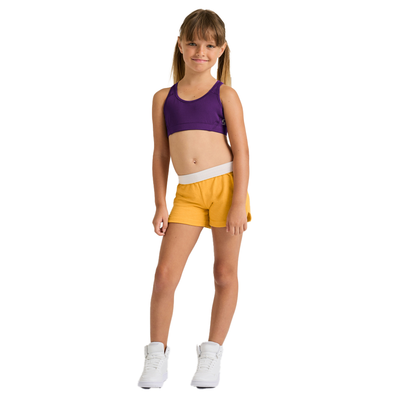 girl facing forward wearing navy top and yellow shorts 1210G fullbody