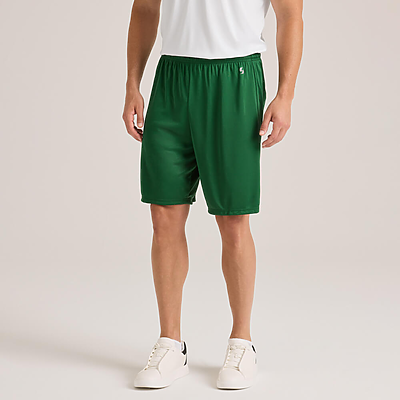 man facing forward wearing a white short sleeve t shirt and green shorts 1540M