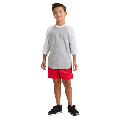 boy facing front wearing a grey and white baseball t shirt and red shorts 210B full