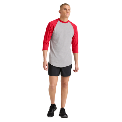 man facing front wearing a grey and red baseball t shirt and black shorts 210M full