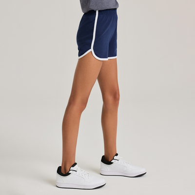 girl facing side wearing a grey tank top and navy shorts with white piping 5707G