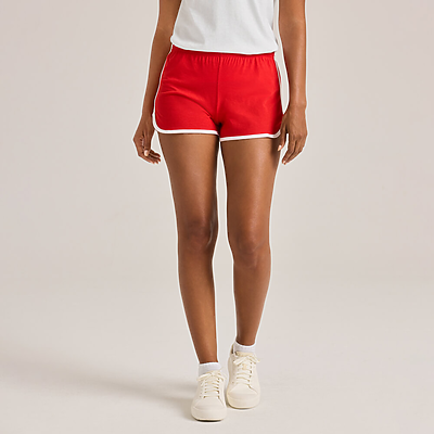 woman facing forward wearing white shirt and red shorts with white piping 5707V