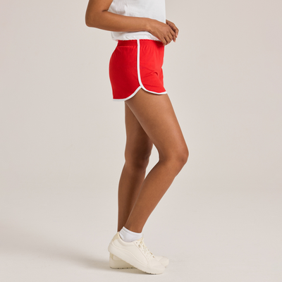 woman facing side wearing white shirt and red shorts with white piping 5707V