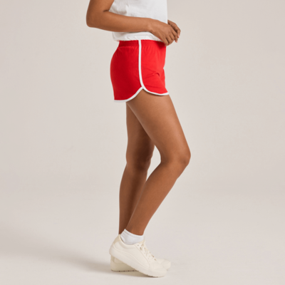 woman facing side wearing white shirt and red shorts with white piping 5707V