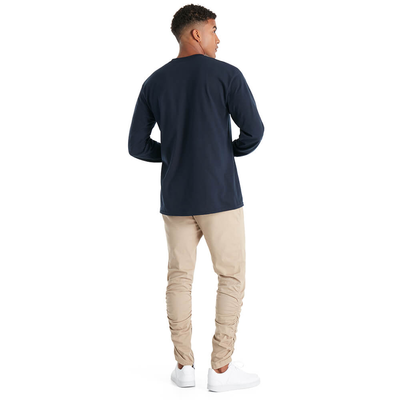 man facing away wearing delta apparel style 61750 long sleeve tee shirt in athletic navy