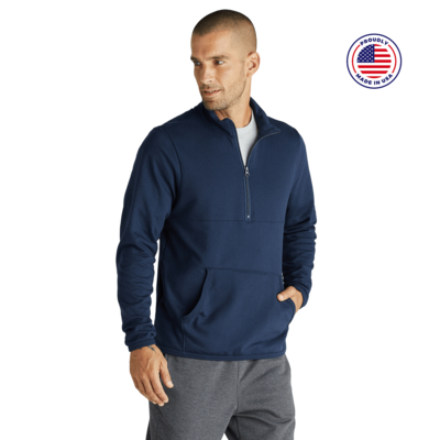 man looking to the side wearing a blue quarter zip pullover