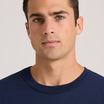 man facing front wearing a navy short sleeve shirt 682M