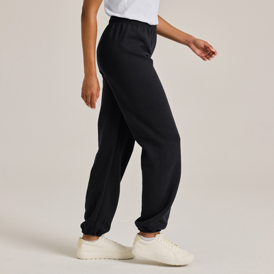 Woman wearing black adult classic sweatpants and white top 9041