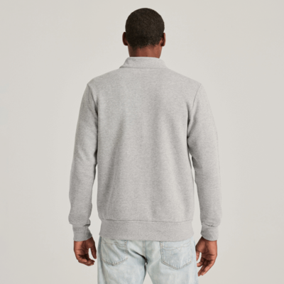 man facing front wearing an oxford full zip fleece sweatshirt with hands in front pockets 9310M full