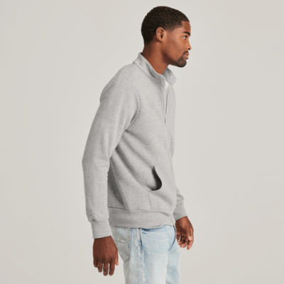 man facing front wearing an oxford full zip fleece sweatshirt with hands in front pockets 9310M