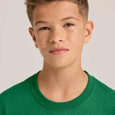 boy facing forward wearing youth midweight cotton shirt B345 neckline