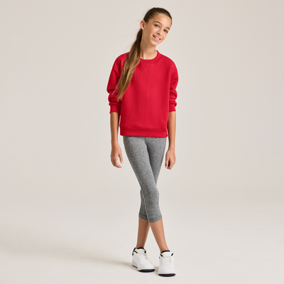 girl facing forward wearing red youth crewneck sweatshirt and grey leggings B9001 full