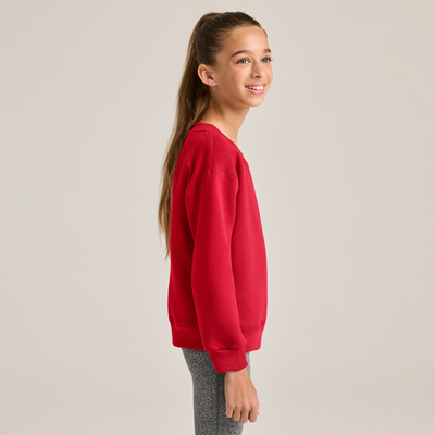 girl facing side wearing red youth crewneck sweatshirt and grey leggings B9001