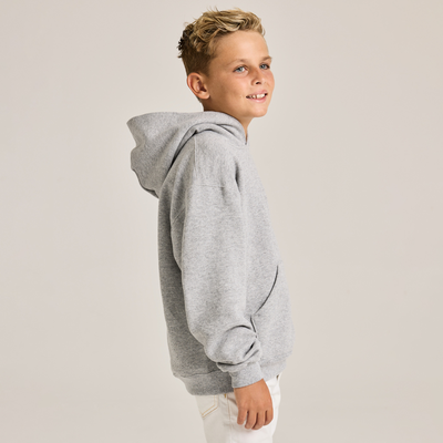 boy facing forward wearing a grey youth classic hooded sweatshirt B9289 side