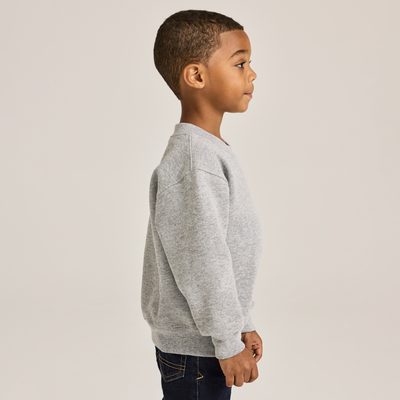 boy facing side wearing grey juvenile classic crewneck sweatshirt J9001