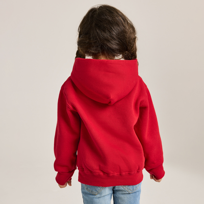 young girl wearing a red fleece hoodie facing backward J9289