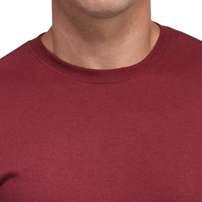 man facing front wearing a cardinal short sleeve shirt and grey jersey shorts