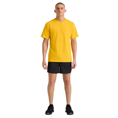 man facing front wearing a yellow midweight short sleeve shirt and black jersey shorts M305