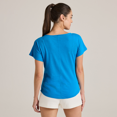 woman facing backwards wearing blue Delta Platinum Ladies' Cvc Dolman wholesale blank Tee style p505c