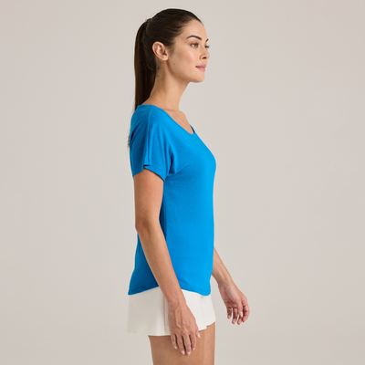 woman facing sideways wearing blue Delta Platinum Ladies' Cvc Dolman wholesale blank Tee style p505c