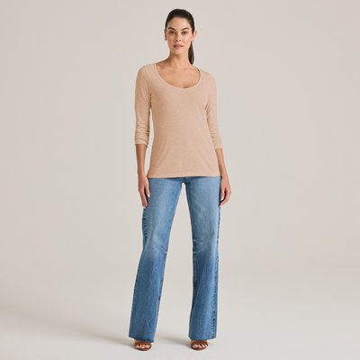 woman facing forward wearing a triblend scoop neck longsleeve tee and jeans P507T