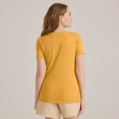 woman facing backwards wearing Delta Platinum Ladies Slub Short Sleeve V-Neck wholesale blank t-shirt in ginger color style p514s