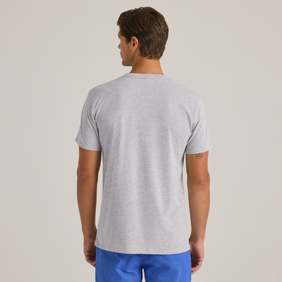man looking backwards wearing  grey short sleeve crew neck platinum shirt and blue shorts - P601C
