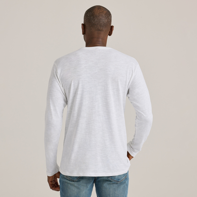 man facing backward wearing Delta Platinum Adult Slub Long Sleeve Crew Neck blank wholesale Tee in white color